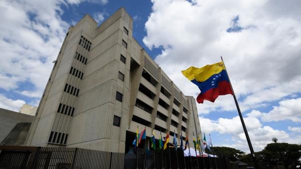 FILE - A Venezuelan flag flies outside the Supreme Court in Caracas, Venezuela, Jan. 22, 2021.